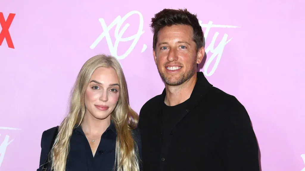 Portrait image of Matt Hommel with a woman at a branded event, showcasing personality and style.